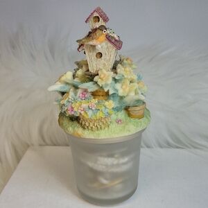 Decorative Birdhouse Trinket Filled With Earrings.